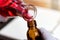 Researcher is pouring chemicals into bottles. Scientist working at the laboratory