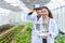 Researcher using drone controller with fly view glasses monitor plant growing in Agriculture farm