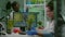 Researcher woman measuring eco sapling while observing biological transformation