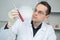 Researcher at work in laboratory with blood pipette