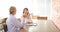 Researchers and scientists talking and drinking coffee at a cafe in their leisure time