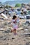 RESEN, MACEDONIA -  JULY 23 : Unidentified child is looking at magazine paper in a garbage dump