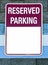 RESERVED PARKING sign attached to wall