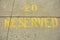 Reserved parking spot in yellow spray paint on concrete, fabulous texture