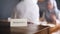 Reserved sign on the table. Two muslim women sit down the table on the background