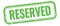 RESERVED text on green grungy vintage stamp