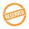 RESERVED text on orange grungy round stamp