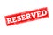 RESERVED written on red rubber stamp