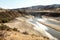 A reservoir of irrigation water drained under the scorching rays of the sun