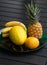 Resh exotic fruits on black table