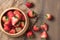 Resh sliced Red berry strawberries in wood bowl