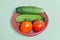 Resh tomato and cucumber in the red basket