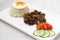 Reshly cooked Filipino food called Tapsilog or thin beef slices, egg and fried rice