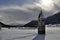 Resia iced lake,tower bell and sun
