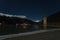 Resia/Reschen, South Tyrol, Italy, 2016 - 12 10: Curon Bell tower night sight appearing from frozen lake surface, Resia, South Ty