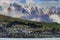 Residence and rural farm against high mountain in queenstown southland new zealand