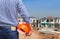 Resident engineer holding yellow safety helmet at new home building under construction site