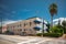 Residential apartment building in Miami Beach Florida with blue awnings