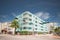 Residential apartment building in Miami Beach light baby blue. Long exposure motion blur shot