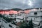 A residential area under the hill of Athens, the setting sun illuminates the white houses