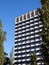 Residential building with a modern facade. Modern geometry architecture against the blue sky. Minimalist aesthetics. Geometric