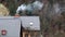 Residential building in the suburbs on a cloudy day in cold autumn near the forest. A chimney on a brick house with