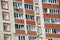 Residential building wall with windows and balconies