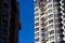 Residential buildings against the blue sky. A modern house of white color in the light of the sun.