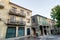 Residential buildings in Pontevedra. Coloured windows masonry walls and stone columns