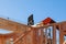 Residential construction home, wood beams with blue sky at construction