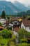 Residential district of small town Fussen near Neuschwanstein castle. Small alpine chalets with red