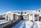 Residential duplex house with front yard in snow on bright winter day in Canada