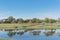 Residential house with park and lake with reflection near Dallas