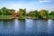 Residential houses with personal piers on Konka River coast in Kherson floodplains Ukraine. Suburban area with buildings on the