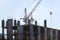 Residential lots building of tower construction work site with cranes with blue sky