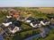 Residential neigborhood in sunset, view from drone