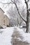 Residential street with brick apartment buildings on snowy winter day in Chicago, Illinois, USA