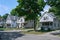 Residential street with traditional detached two story houses