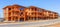 Residential wood frame house construction framing under clear blue sky with space for text