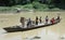 Residents crossing the river by boat solo canoe as a means of crossing to and from Solo Centra Java Indonesia.