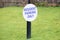 Residents parking only sign on green grass private garden