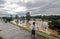 Residents walk past the embankment in the area of urban forest