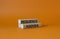 Resilience agenda symbol. Wooden blocks with words Resilience agenda. Beautiful orange background. Business and Resilience agenda