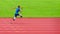 A resilient Asian paralympic athlete, equipped with prosthetic running blades, can be seen intently training on an athletic track