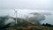 Resilient Wind Farm Amidst Foggy Oceanic Landscape