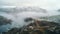 Resilient Wind Turbines On A Norwegian Mountain In The Fog