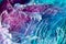 Resin art texture with turquoise, lilac and white colors. Liquid backdrop with splashes and swirls. Abstract frozen