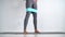 Resistance band fitness woman doing squat exercise with fabric booty band strap