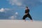 Resolute man practicing Japanese martial arts in desert