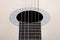 Resonator of a classical guitar with the strings.